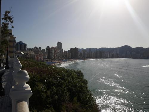a view of a river with buildings in the background at Hotel Santa Faz in Benidorm