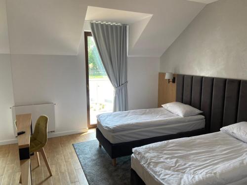 Un pat sau paturi într-o cameră la Hotel Sebory