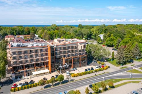 an overhead view of a building with a road in front at Hotel Leda Spa - Adults Only in Kołobrzeg