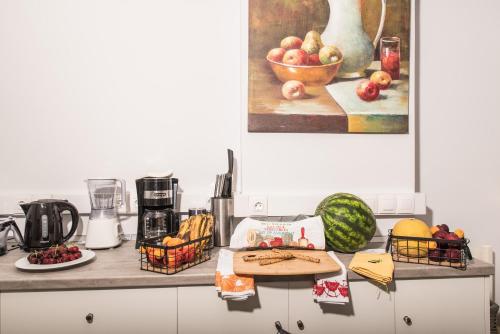 a kitchen counter with fruits and vegetables on it at Denise Beach Hotel in Laganas