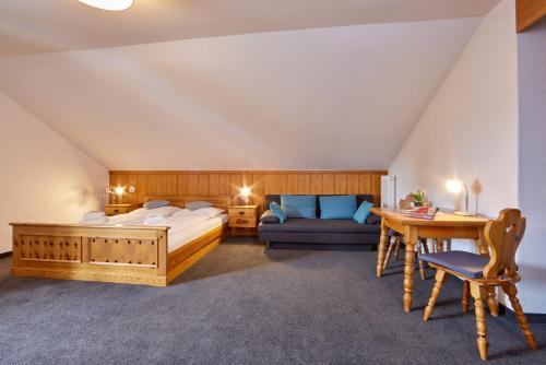 Säng eller sängar i ett rum på Hotel Alter Wirth
