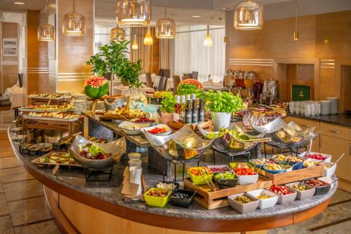 a buffet in a hotel with many different types of food at Hotel Leda Spa - Adults Only in Kołobrzeg