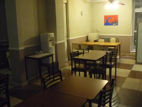 a restaurant with tables and chairs in a room at Hotel San Martin in Buenos Aires