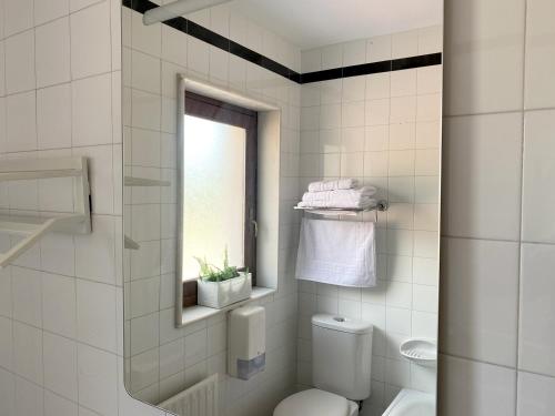A bathroom at Hotel Avelina