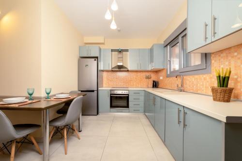 Kuchyň nebo kuchyňský kout v ubytování Gold Olive Suites by "elite"
