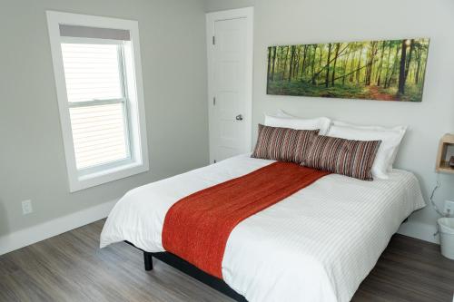 Una cama o camas en una habitación de Morel Executive Suites