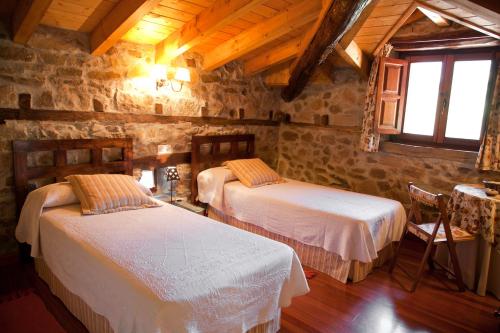 Postel nebo postele na pokoji v ubytování Casa Rural La Lastría