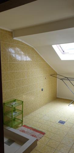 an empty room with a skylight in a building at Sobe Jana in Budva