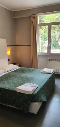 Postel nebo postele na pokoji v ubytování Hotel Laguna Residence