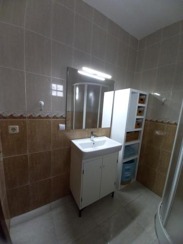 a bathroom with a sink and a mirror at GARABATO in La Pared