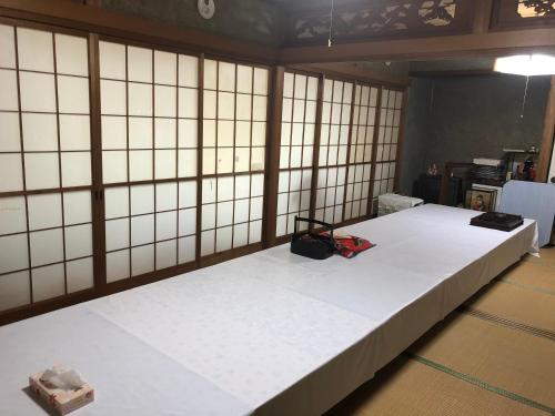 Tempat tidur dalam kamar di Youyousanso Traditional B