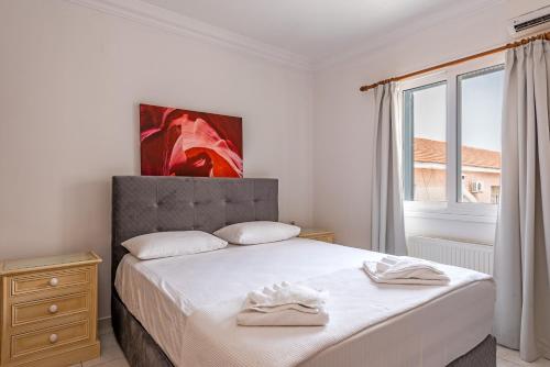 Ένα ή περισσότερα κρεβάτια σε δωμάτιο στο Elegant Living
