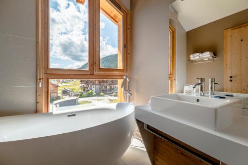 Koupelna v ubytování Le Chalet Blanc Hôtel & Spa