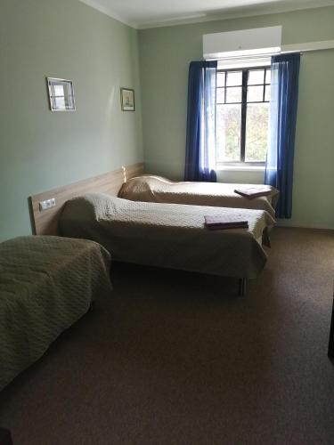 Ένα ή περισσότερα κρεβάτια σε δωμάτιο στο Goodwin Guest House