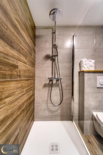 a bathroom with a shower and a sink at Spa et Sauna au coeur de Metz (unenuitametz) in Metz