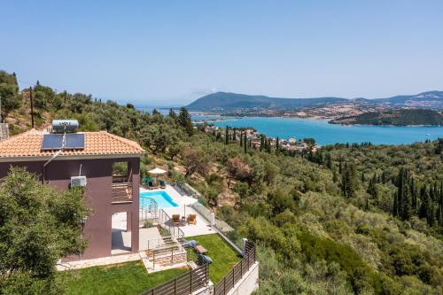 a house on a hill with a view of a lake at Koumaries Villas in Lygia