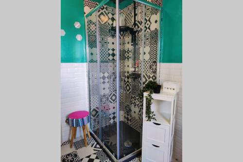 a shower with a glass door in a bathroom at SUITE Assisi - L attico delle meraviglie in Santa Maria degli Angeli