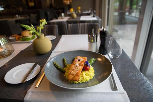 a plate of food on a table at a restaurant at FischerS in Kassel