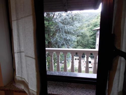 a view of a fence from a window at Antica Dimora del Portico in Borgiallo
