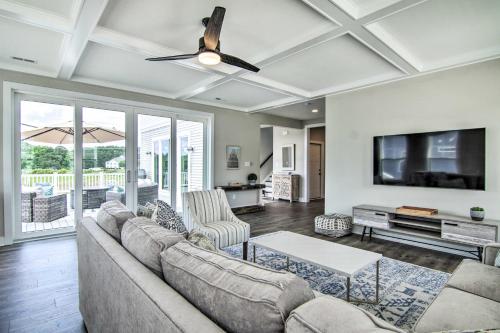 a living room with a couch and a flat screen tv at 2 Mi to Bethany Beach Upscale Coastal Home! in Ocean View