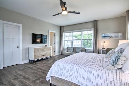 a bedroom with a bed and a ceiling fan at 2 Mi to Bethany Beach Upscale Coastal Home! in Ocean View