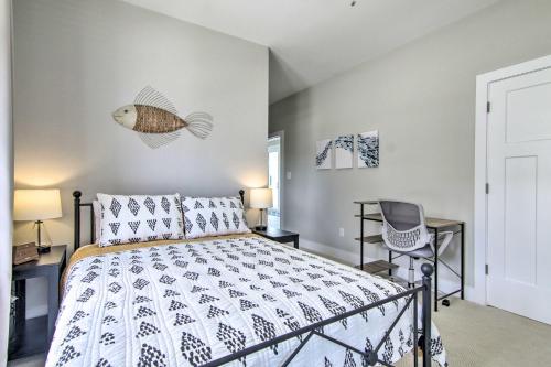 a bedroom with a bed with a fish on the wall at 2 Mi to Bethany Beach Upscale Coastal Home! in Ocean View