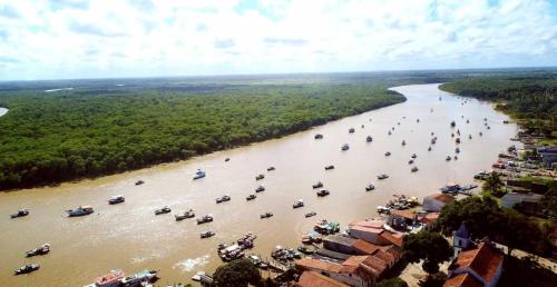 an aerial view of a river with boats in it at Residencial Gaivotas 40m da praia Nova vicosa in Nova Viçosa