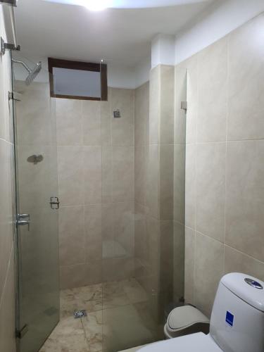 a bathroom with a shower and a toilet at Villa del Socorro in Jardin