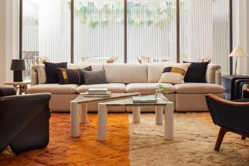 a living room with a couch and a coffee table at Kimpton Alton Fisherman's Wharf by IHG in San Francisco