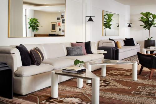 a living room with a couch and a table at Kimpton Alton Hotel, an IHG Hotel in San Francisco