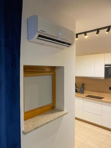 Kuchyňa alebo kuchynka v ubytovaní Secret Apartments Chełmska