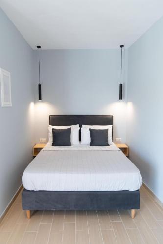 a bedroom with a large bed with two pillows at Preveza Suitestay Apartments Dodonis 28 in Preveza