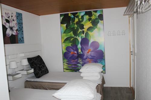 En eller flere senge i et værelse på Holiday rooms Rudkøbing