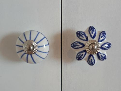 two blue and white vases sitting on a door at Casa tra Cielo e Mare in Lipari