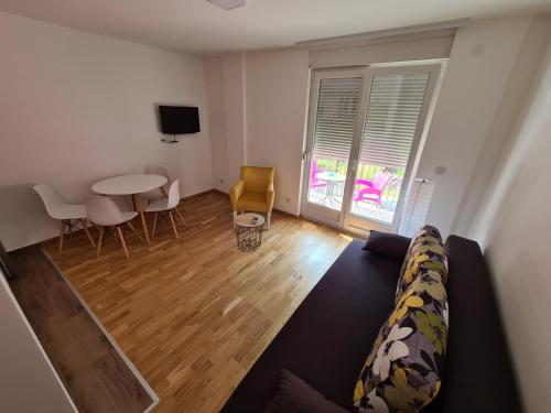 a living room with a couch and a table at Apartman Jelena Sokobanja in Soko Banja