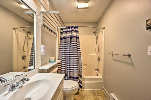 a bathroom with a sink and a toilet and a shower at Village of Loon Mtn Condo with Fireplace and Balcony! in Lincoln