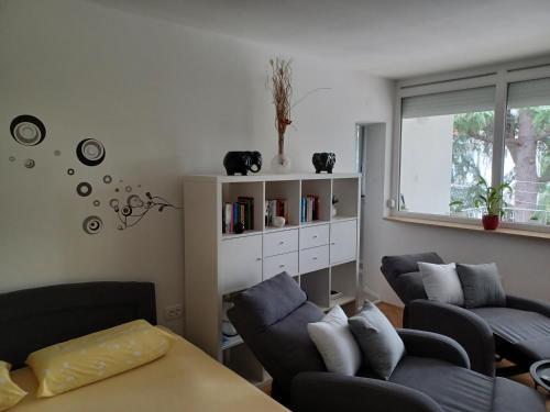 a living room with two couches and a table at Apartment Bono Poreč in Poreč