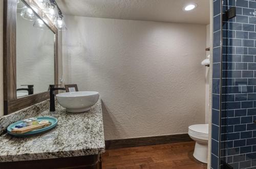 a bathroom with a sink and a toilet at Bluebird in Elk City