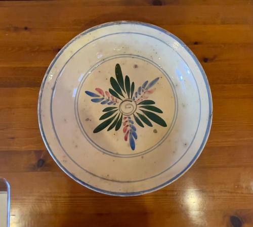 a plate on a table with a flower on it at Agri Resort Masusa in Aquara
