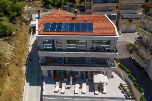 an aerial view of a house with solar panels on the roof at Casa Nuova in Kotor