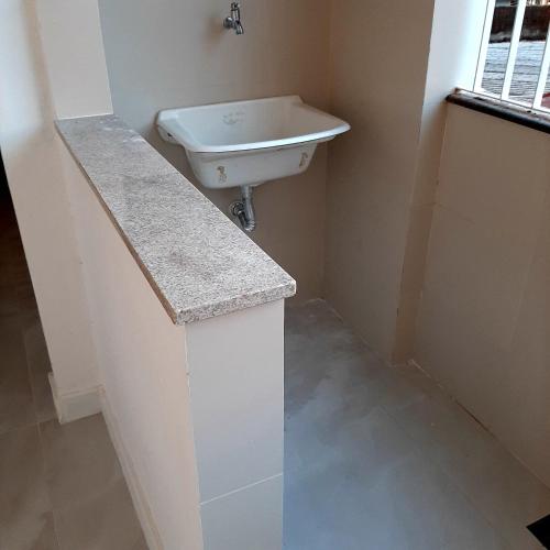 a bathroom with a sink and a toilet in it at Apartamento Mania in Vitória