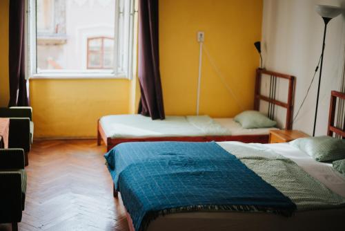 Postel nebo postele na pokoji v ubytování Nap Hostel Pécs