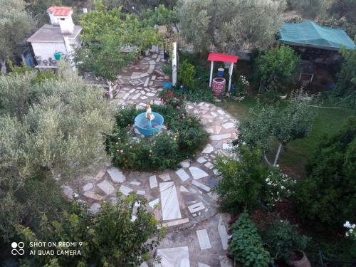 an aerial view of a garden with a fountain at BELLA-CAZA in Mákri