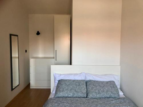 a bedroom with a bed with two pillows on it at Apartment Anni in Pula