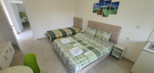 Postel nebo postele na pokoji v ubytování Antonio Apartments