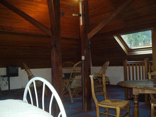 a room with chairs and a table and a window at maison à 400 mètres de la plage in La Baule