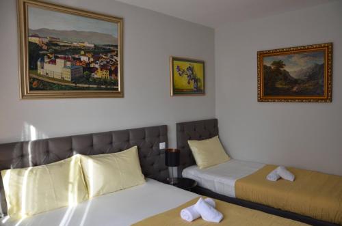 Cama o camas de una habitación en Ars Square Apartments