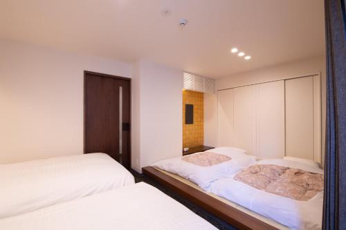 Ένα ή περισσότερα κρεβάτια σε δωμάτιο στο Hotel Celeste Shizuoka