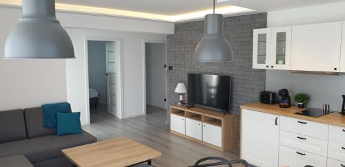 Η κουζίνα ή μικρή κουζίνα στο Porta Mare Apartamenty Słoneczne Tarasy