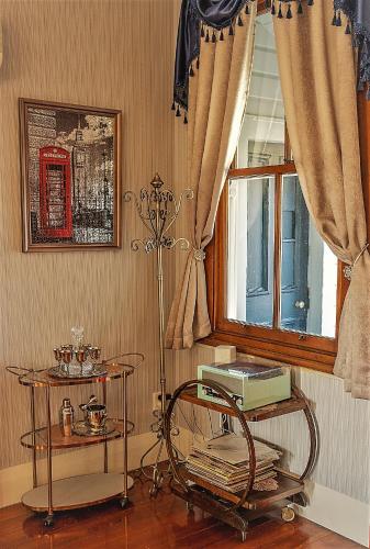 a room with two tables and a window at 5-Star OLD POST OFFICE HOLIDAY HOME - 5-7-Bedroom Art Deco Elegance in Owhango